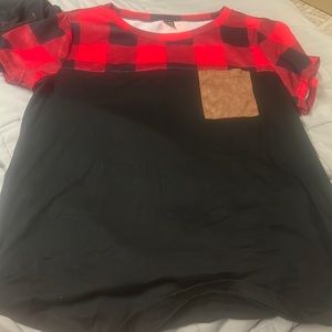 Black shirt with red plaid